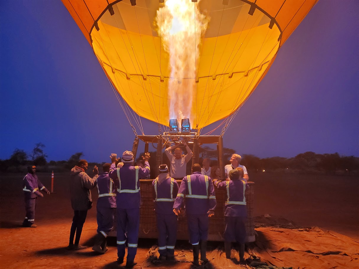 Hot air balloon drifting over the Kenyan savannah at sunrise